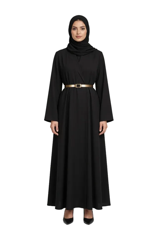A model in a black abaya with a thin gold belt and a black hijab, standing
